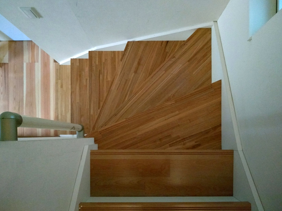 Inspiration for a scandinavian wood staircase in Tokyo with wood risers.