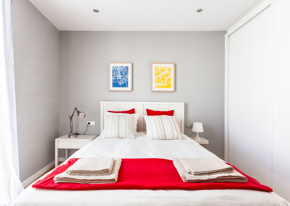 Inspiration for a mid-sized contemporary master dark wood floor bedroom remodel in Barcelona with gray walls and no fireplace