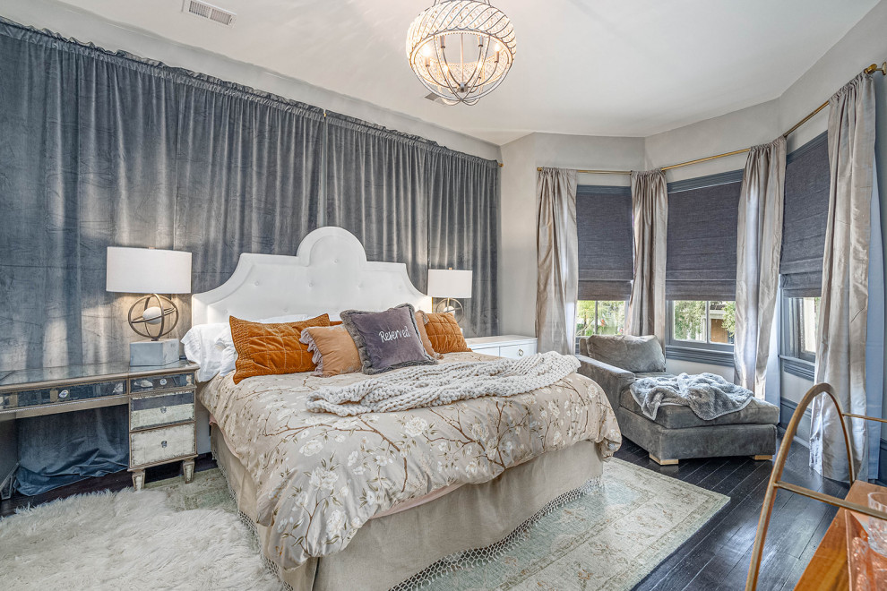 Photo of an expansive transitional master bedroom in Other with grey walls, dark hardwood floors and black floor.