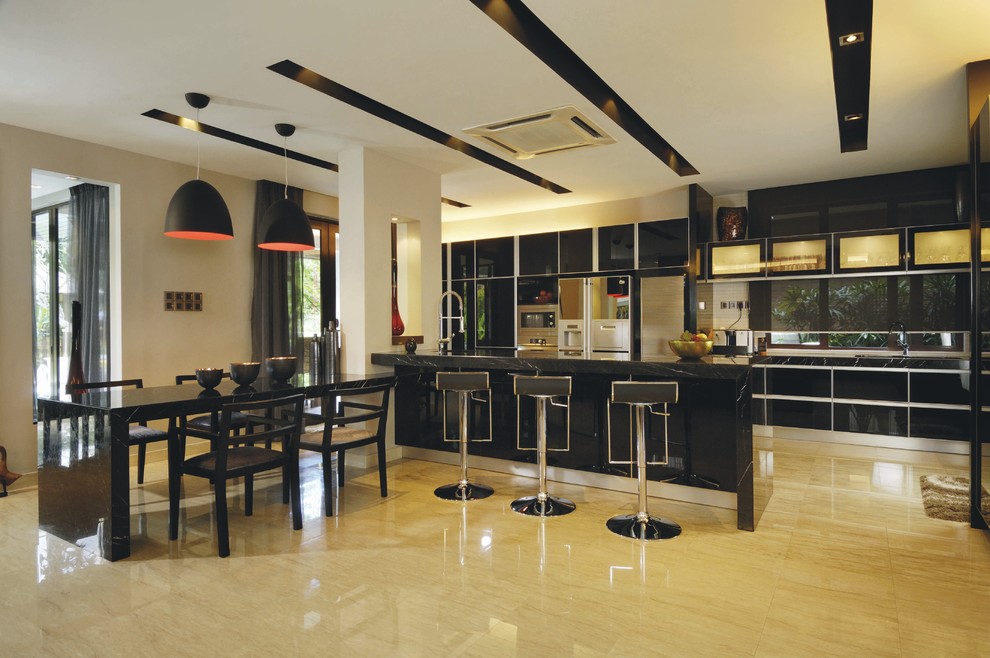 Design ideas for a tropical eat-in kitchen in Other with flat-panel cabinets and black cabinets.