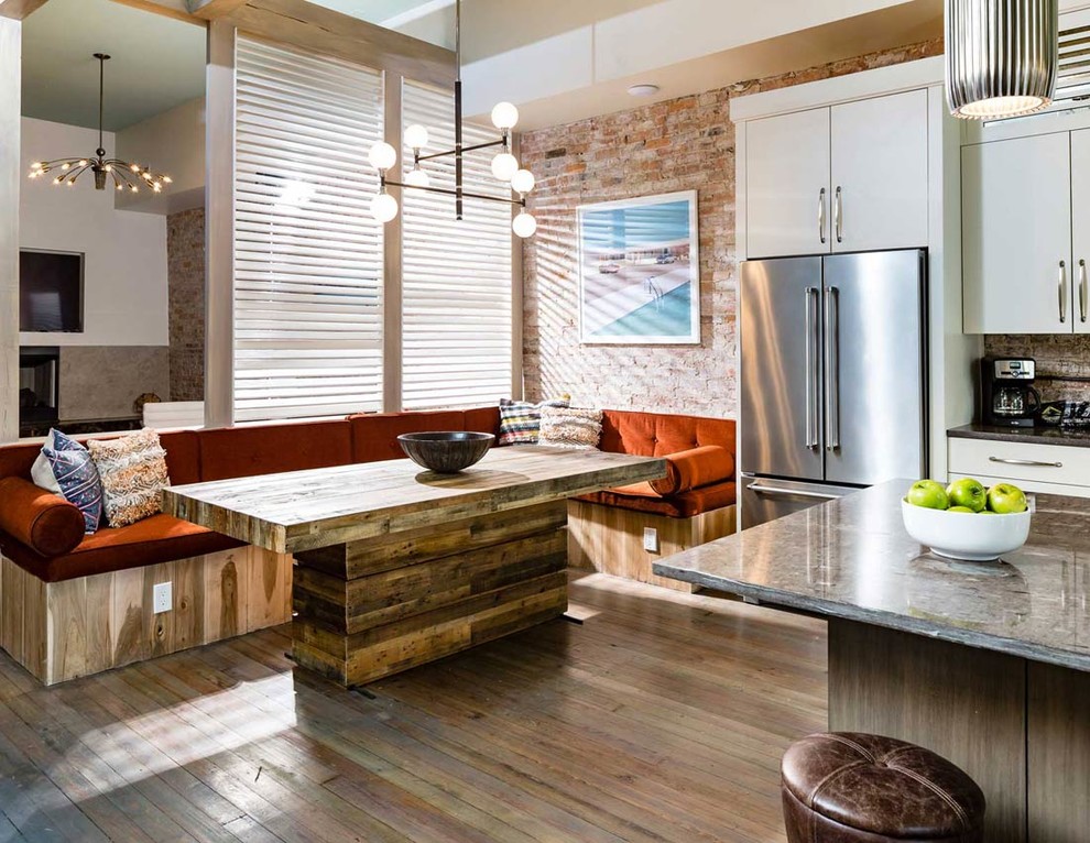 Inspiration for a small contemporary kitchen/dining combo in Nashville with light hardwood floors.