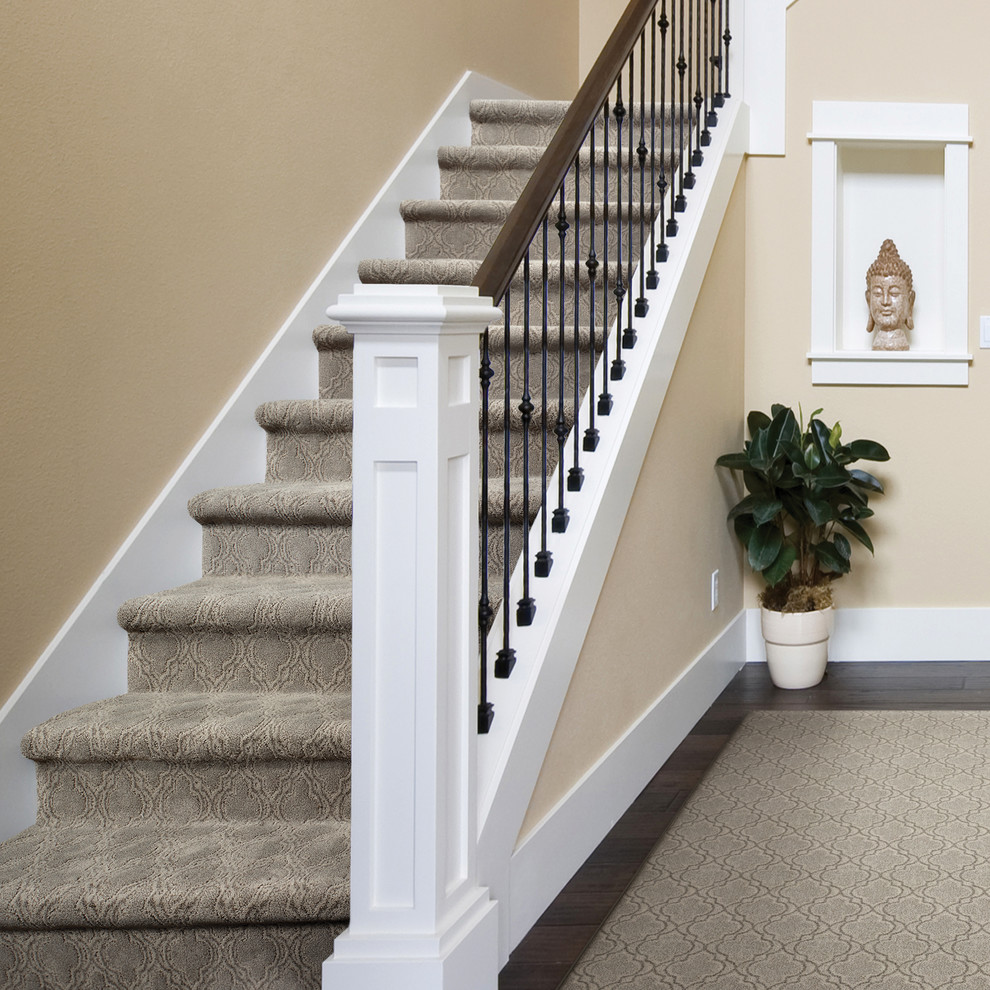 Mid-sized transitional carpeted l-shaped staircase in Boise with carpet risers.