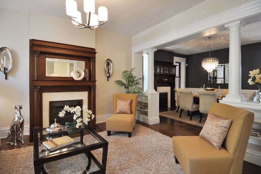 Small elegant formal and open concept dark wood floor living room photo in St Louis with a standard fireplace, beige walls and a brick fireplace