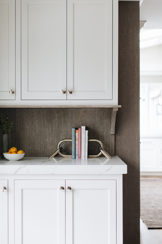 Eat-in kitchen - mid-sized transitional dark wood floor and brown floor eat-in kitchen idea in Chicago with a farmhouse sink, beaded inset cabinets, white cabinets, quartz countertops, paneled appliances, an island and white countertops
