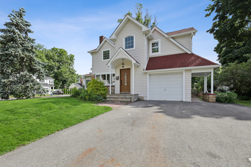Front Exterior with Side Carport and Garage