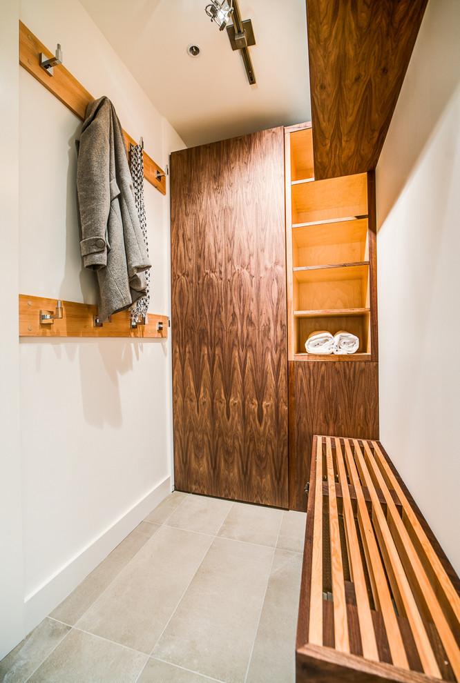 Photo of a contemporary mudroom in Vancouver with white walls.