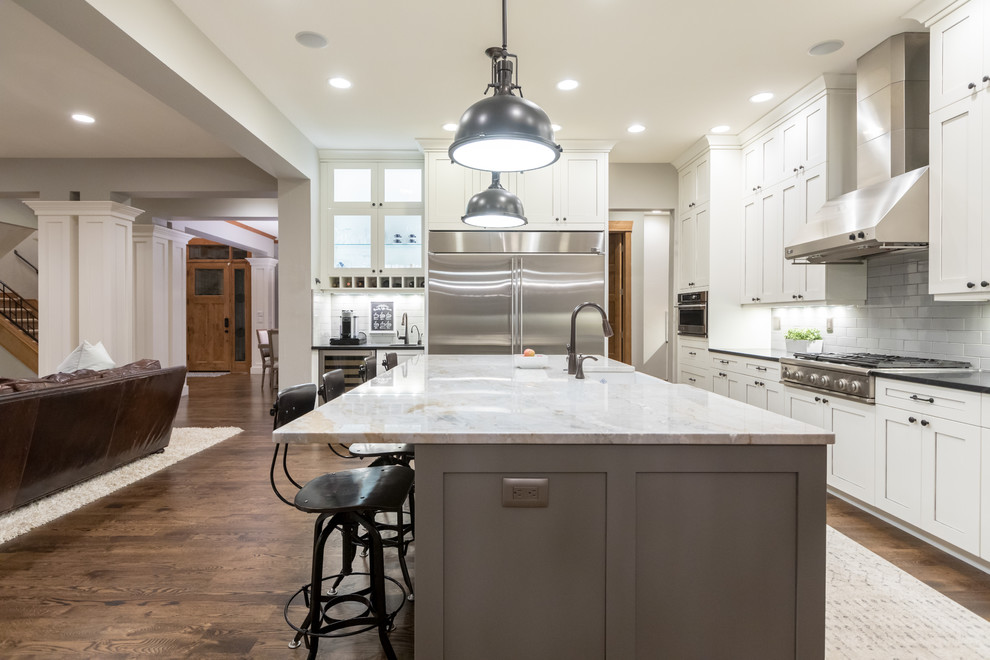 Example of a large transitional l-shaped eat-in kitchen design in Denver