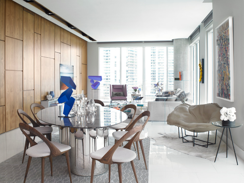 This is an example of a mid-sized contemporary open plan dining in Miami with grey walls.