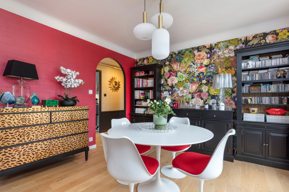 Medium sized bohemian dining room in Rennes with multi-coloured walls, light hardwood flooring, no fireplace, beige floors and wallpapered walls.
