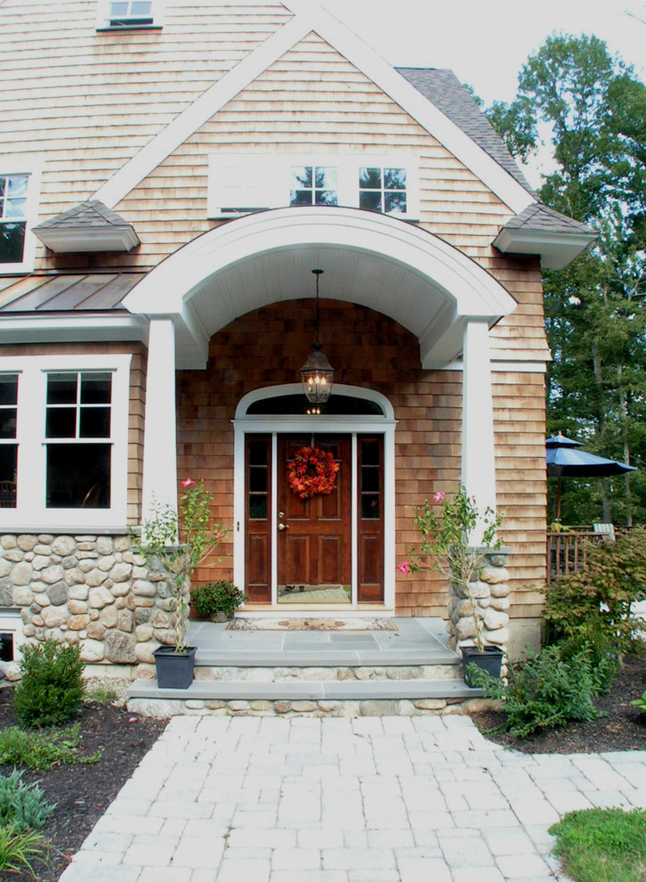 Photo of a traditional front door in Boston with a single front door and a dark wood front door.