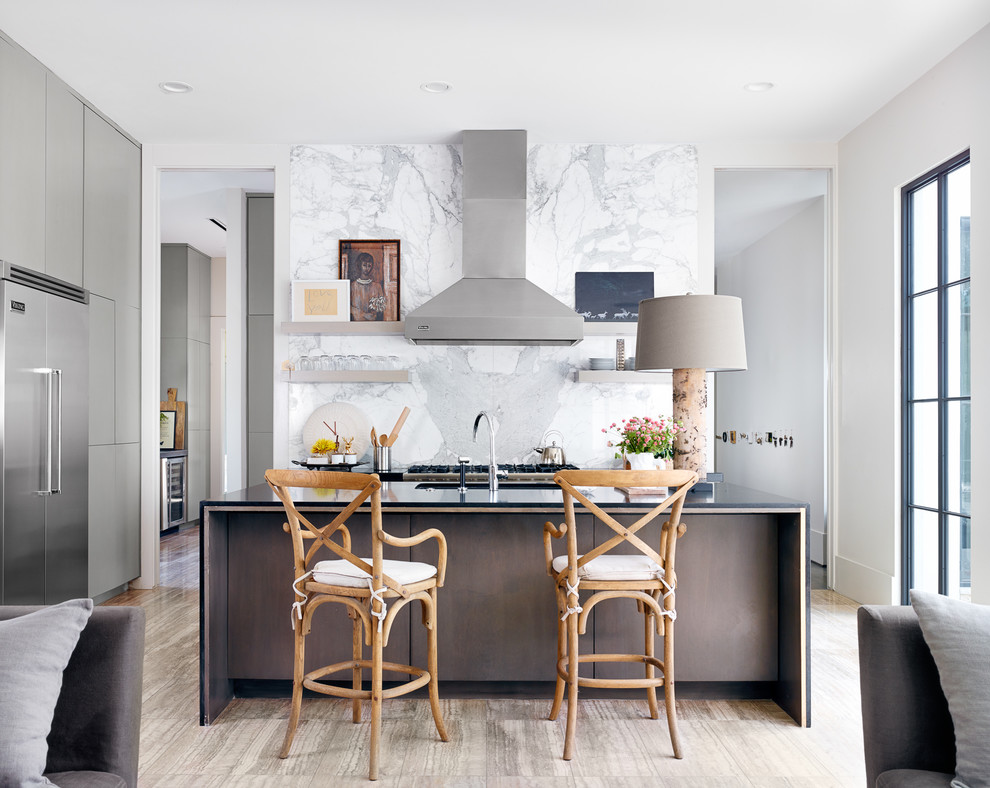 Inspiration for a small transitional u-shaped open plan kitchen in Austin with flat-panel cabinets, grey cabinets, stainless steel appliances and with island.