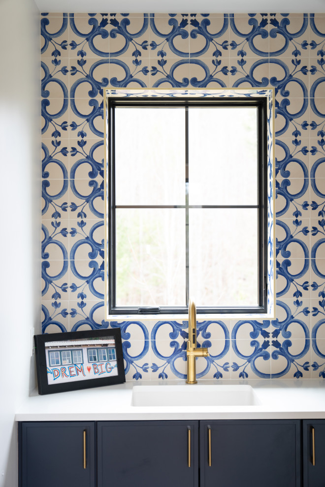 Laundry room - transitional laundry room idea with ceramic backsplash