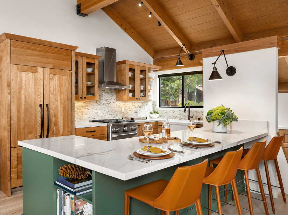Mid-sized mountain style u-shaped light wood floor, beige floor and exposed beam open concept kitchen photo in Other with a farmhouse sink, shaker cabinets, green cabinets, quartz countertops, green backsplash, porcelain backsplash, paneled appliances, a peninsula and multicolored countertops
