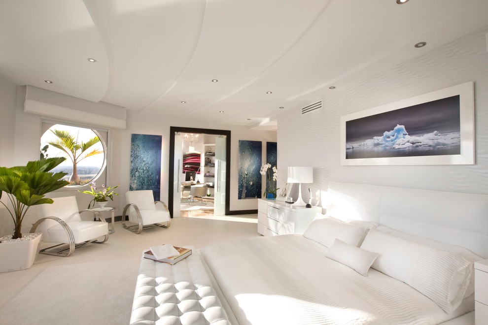 Modern bedroom in Miami with white walls and carpet.