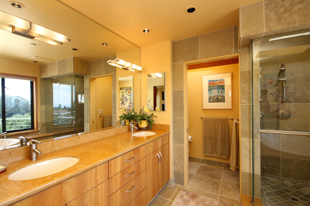 Large transitional master bathroom in San Francisco with an undermount sink, flat-panel cabinets, light wood cabinets, an alcove shower, beige tile, ceramic tile, yellow walls, ceramic floors, beige floor, a hinged shower door and an enclosed toilet.