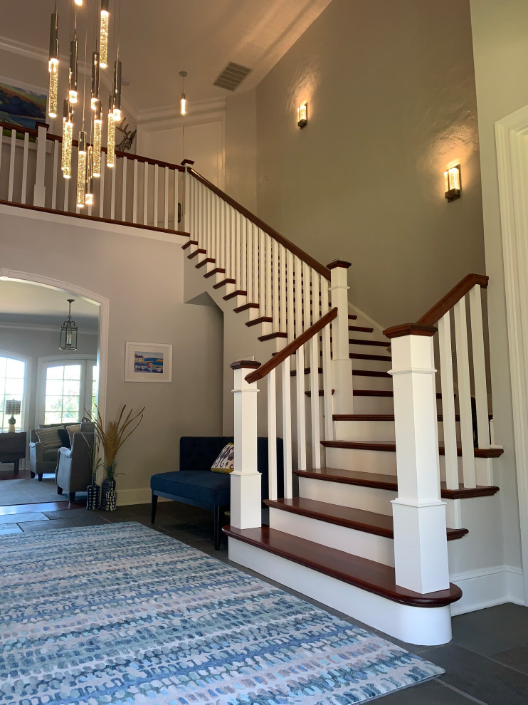 Design ideas for a large traditional wood l-shaped wood railing staircase in Portland with wood risers.