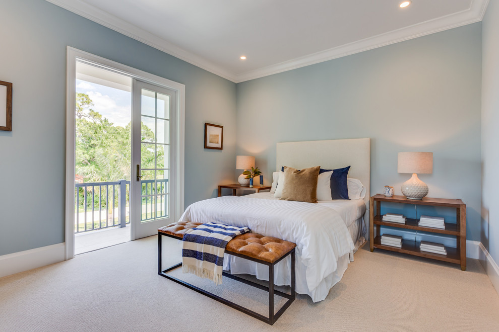 Photo of a medium sized coastal guest bedroom in Other with blue walls, carpet and beige floors.