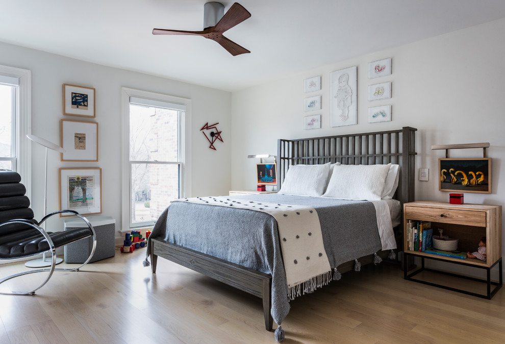 Mid-sized contemporary kids' bedroom in Chicago with white walls, light hardwood floors and beige floor for kids 4-10 years old and boys.