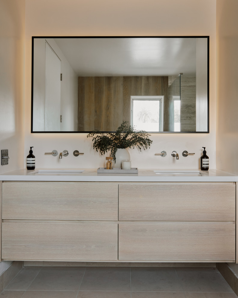 Mid-sized modern master bathroom in Los Angeles with flat-panel cabinets, beige cabinets, a freestanding tub, a corner shower, multi-coloured walls, limestone floors, engineered quartz benchtops, beige floor, a hinged shower door, white benchtops, a double vanity and a floating vanity.