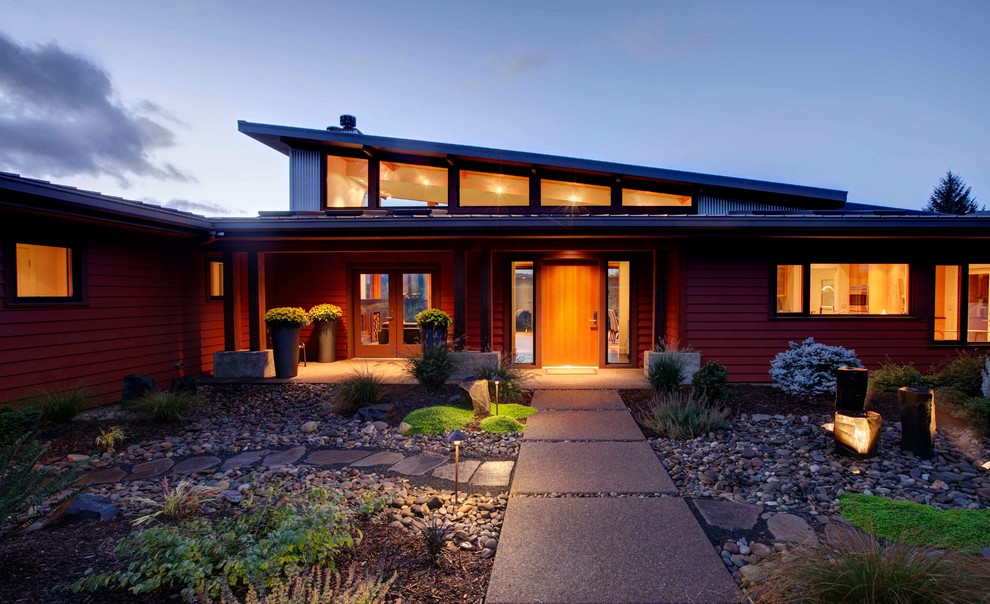 Design ideas for a contemporary one-storey red exterior in Portland with concrete fiberboard siding.