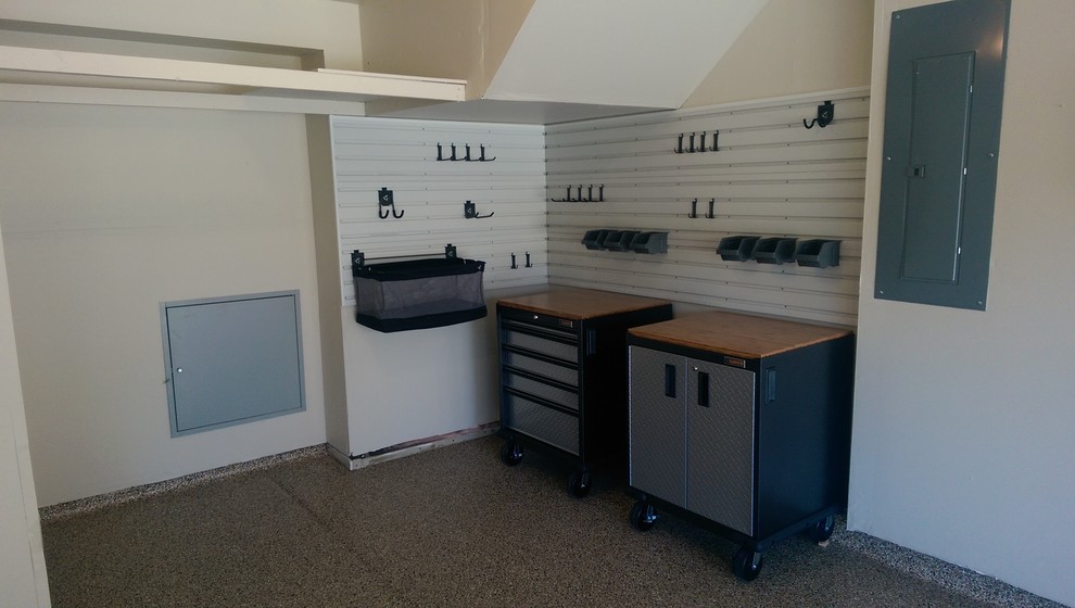 Example of a mid-sized transitional attached two-car garage workshop design in Denver