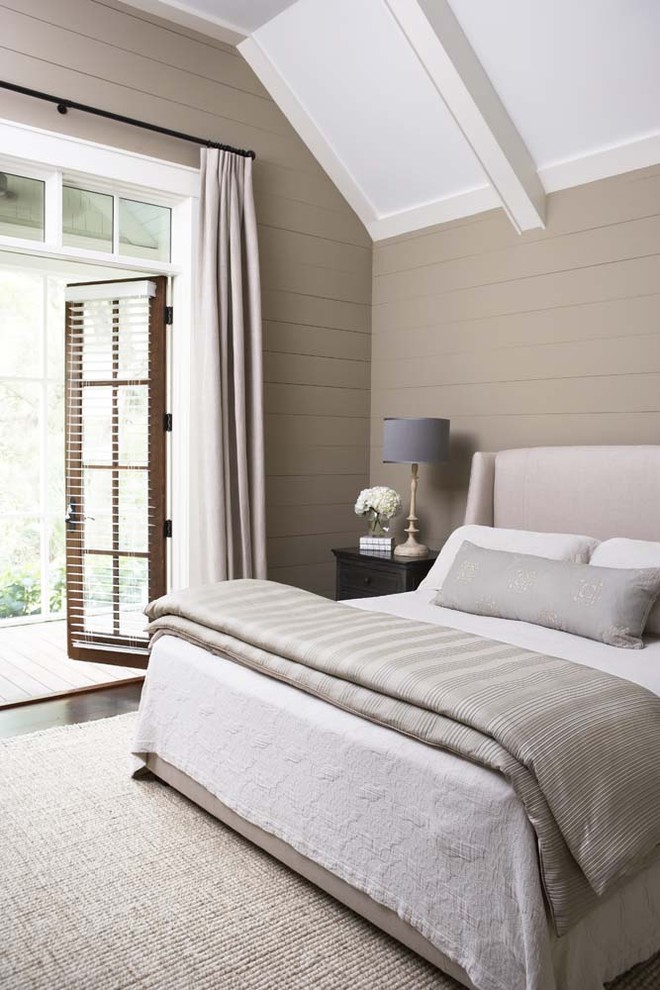 Photo of a large traditional master bedroom in Charleston with beige walls, dark hardwood floors and no fireplace.