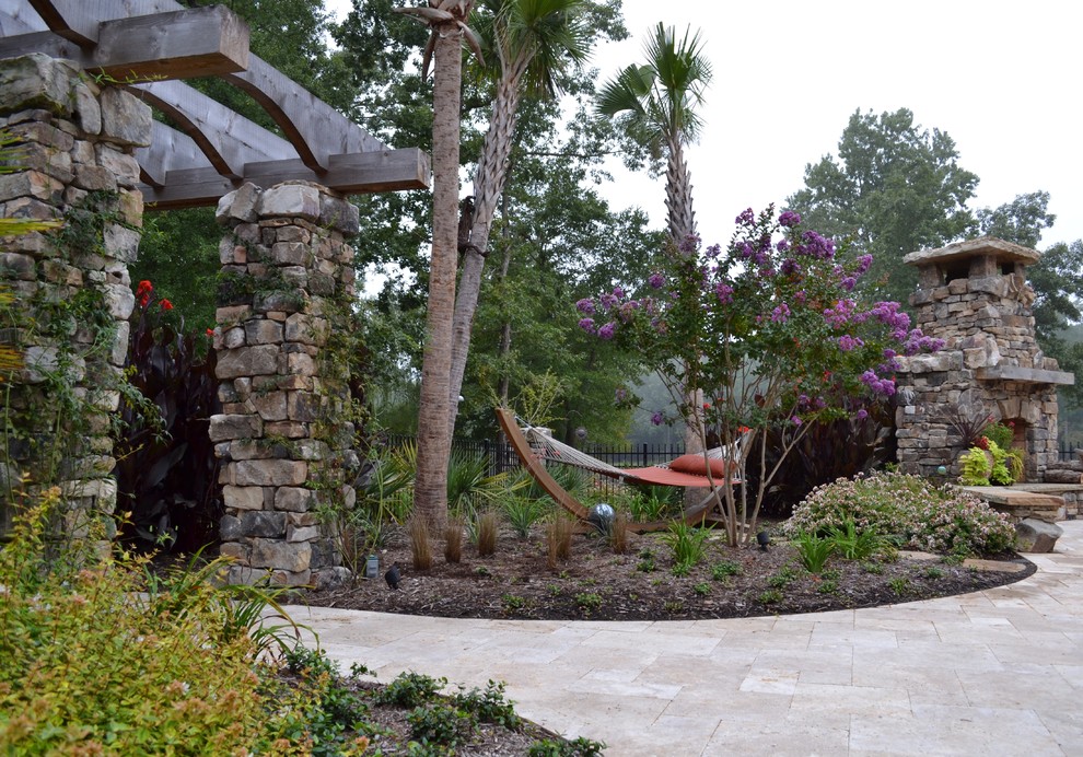 Design ideas for an eclectic patio in Charlotte with a pergola.