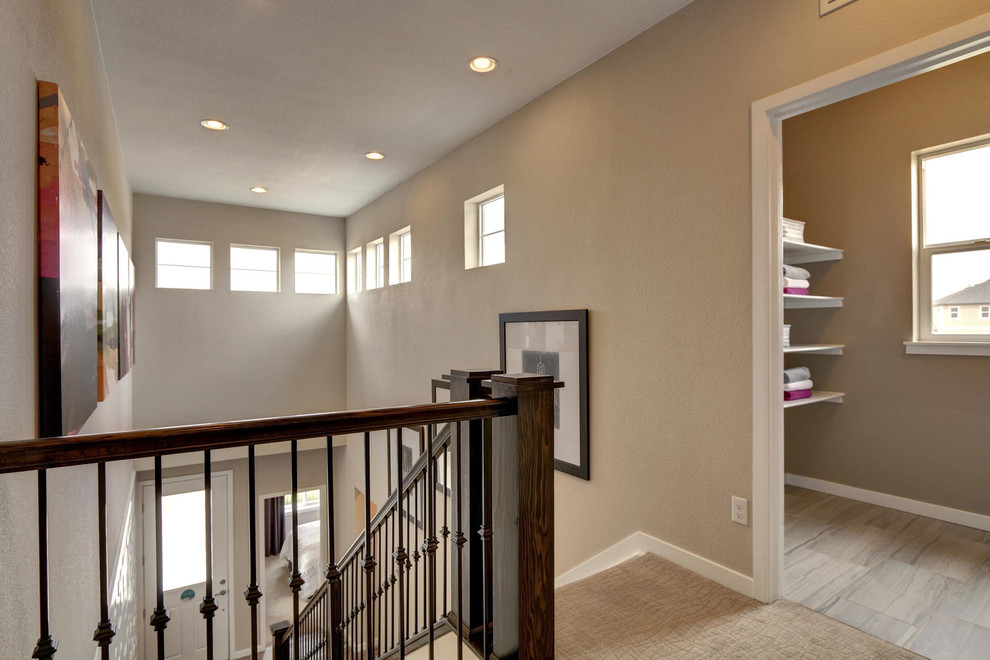 Mid-sized transitional carpeted hallway photo in Denver with beige walls