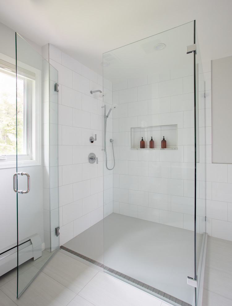 Walk-in shower - modern master white tile walk-in shower idea in Denver with quartz countertops, a hinged shower door and white countertops