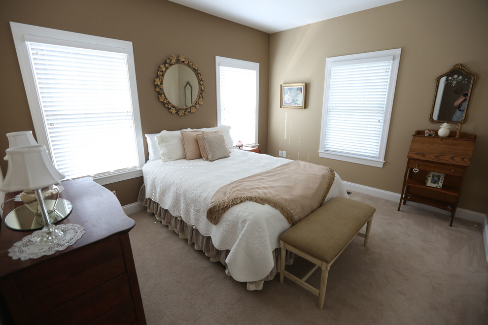 Photo of a mid-sized traditional guest bedroom in DC Metro with beige walls and carpet.