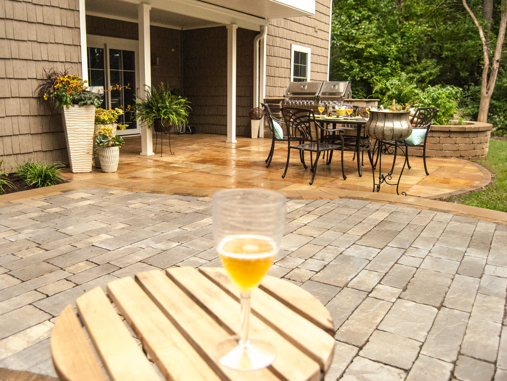 Patio - transitional backyard brick shade patio idea for fall in St Louis