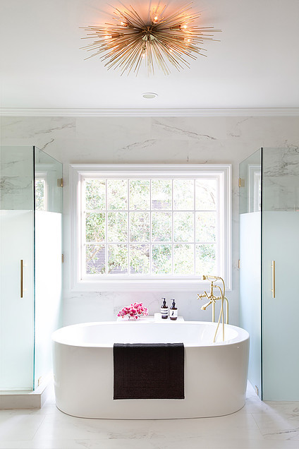 Freestanding bathtub - mid-sized transitional master gray tile, white tile and stone tile marble floor freestanding bathtub idea in Houston with shaker cabinets, beige cabinets, white walls, an integrated sink and solid surface countertops