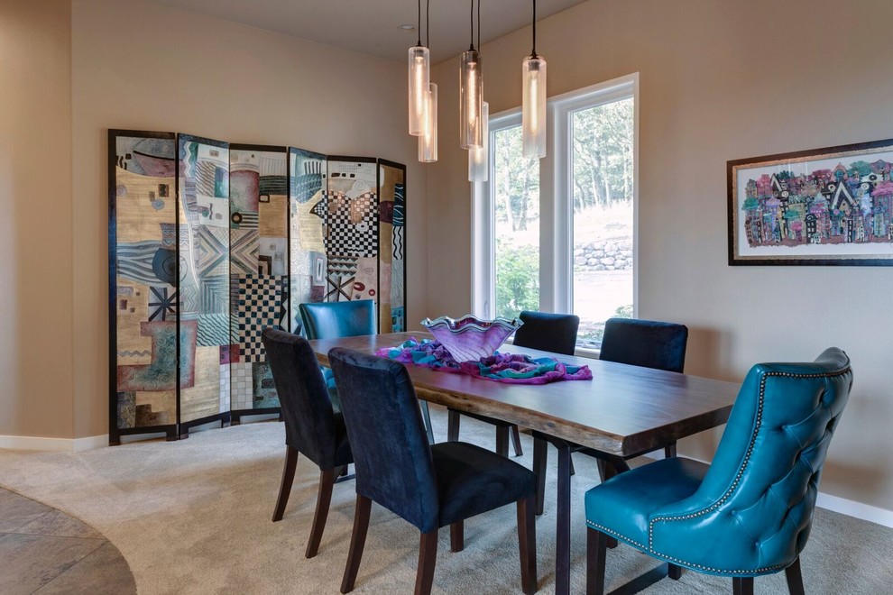 This is an example of a mid-sized midcentury separate dining room in Portland with beige walls, carpet, no fireplace and beige floor.