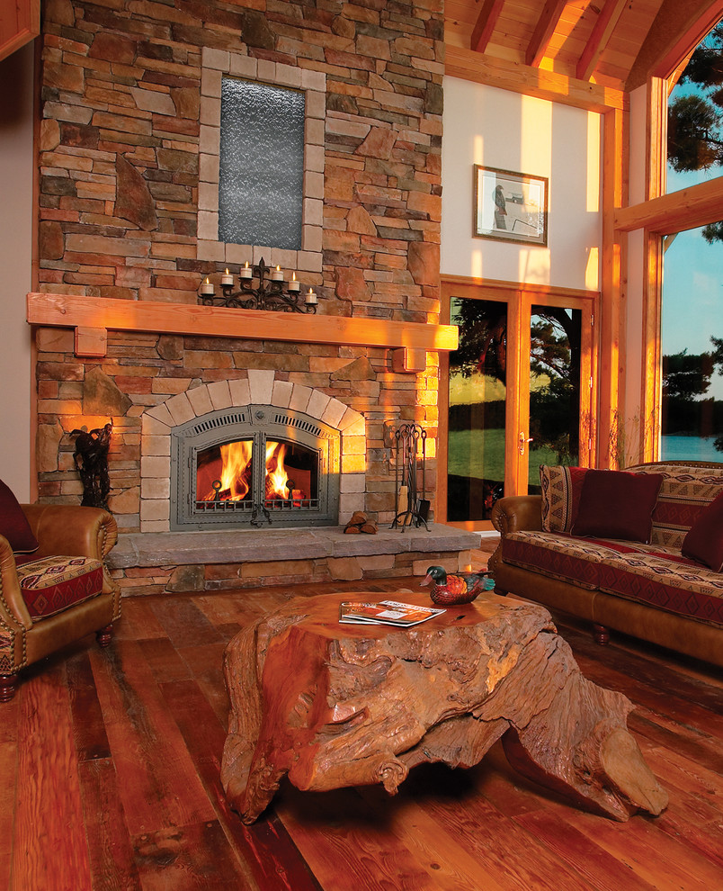 Example of a large mountain style family room design in Other with a metal fireplace