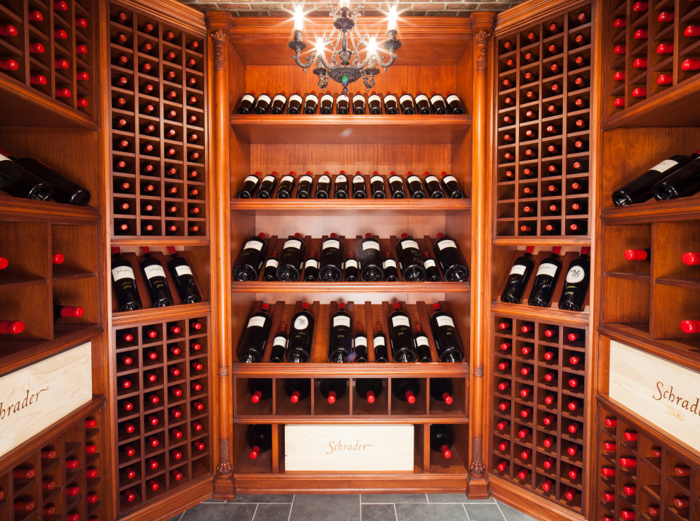 Design ideas for an expansive traditional wine cellar in New York with ceramic floors, display racks and grey floor.