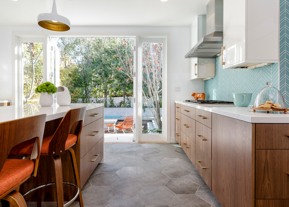 Inspiration for a large midcentury u-shaped separate kitchen in Los Angeles with an undermount sink, flat-panel cabinets, medium wood cabinets, quartzite benchtops, blue splashback, glass tile splashback, stainless steel appliances, cement tiles, with island and grey floor.