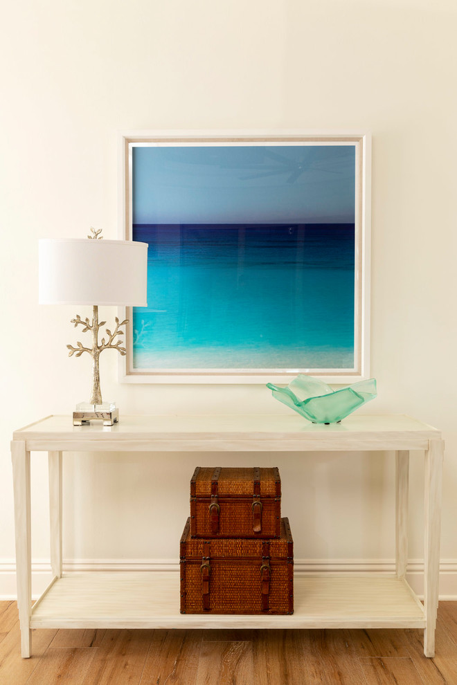 Design ideas for a mid-sized beach style enclosed living room in Other with white walls and light hardwood floors.