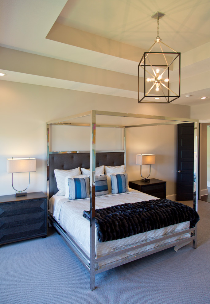 Inspiration for a large contemporary master bedroom in Kansas City with beige walls, carpet and grey floor.