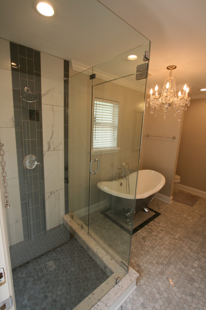 Photo of a mid-sized transitional master bathroom in Jacksonville with raised-panel cabinets, white cabinets, a claw-foot tub, a corner shower, black and white tile, porcelain tile, beige walls, mosaic tile floors, an undermount sink and marble benchtops.