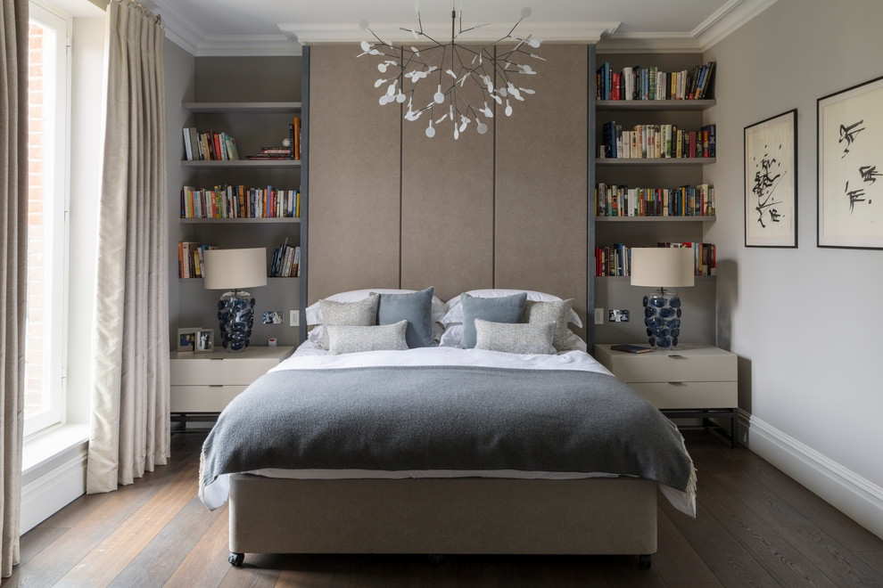 Contemporary bedroom in London with grey walls, dark hardwood floors and brown floor.