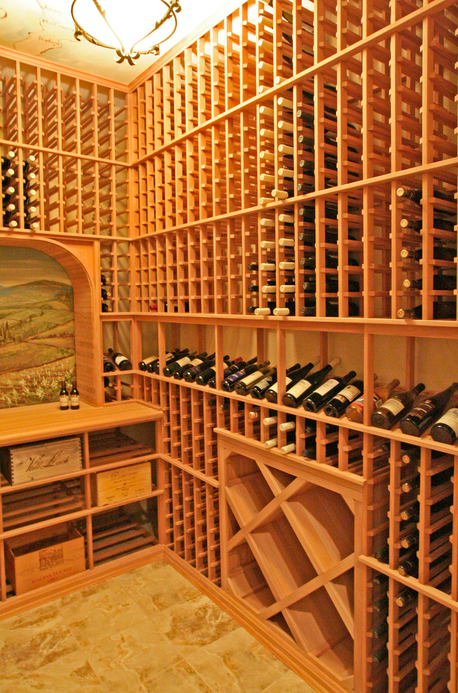 This is an example of a mid-sized traditional wine cellar in New York with storage racks.