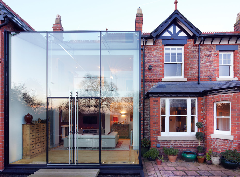 This is an example of a large contemporary glass house exterior in Cheshire.