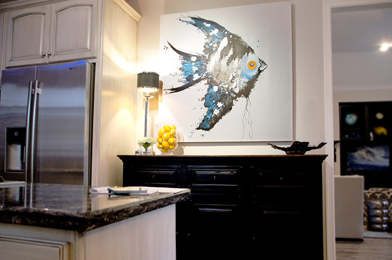 Mid-sized transitional galley porcelain tile eat-in kitchen photo in Houston with a double-bowl sink, raised-panel cabinets, quartzite countertops, white backsplash, stainless steel appliances, white cabinets and an island
