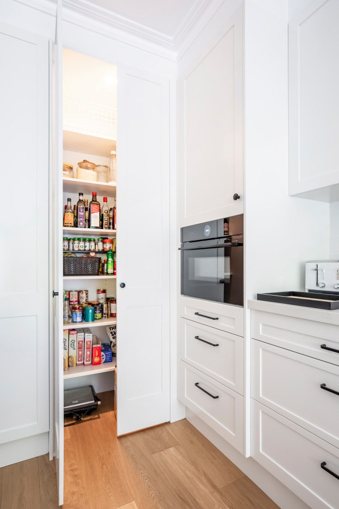 This is an example of a transitional kitchen in Sydney.