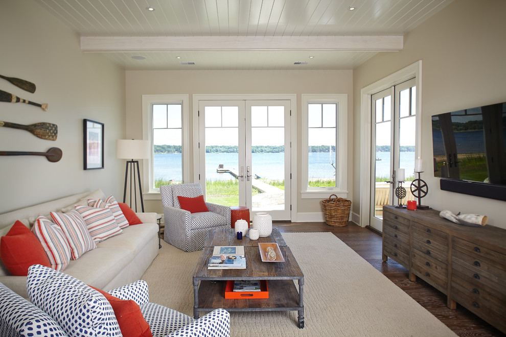 Photo of a beach style family room in Grand Rapids with white walls.