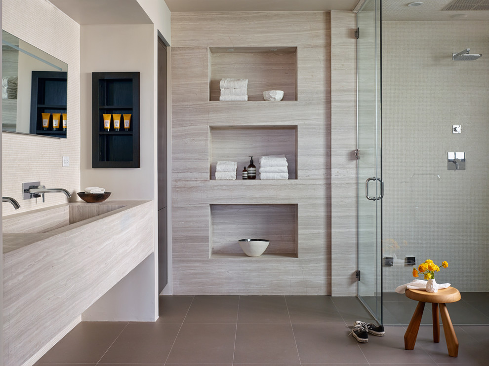 Small contemporary master wet room bathroom in Los Angeles with ceramic floors, a trough sink, grey floor, a hinged shower door, limestone and limestone benchtops.