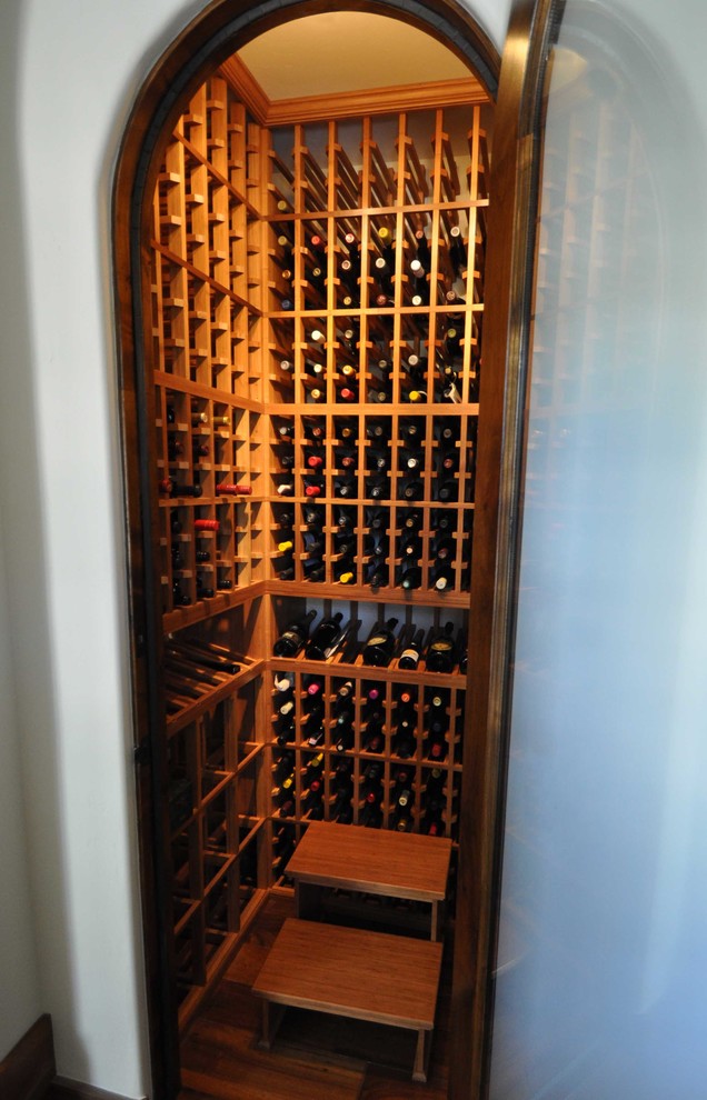 Design ideas for a small traditional wine cellar in San Diego with medium hardwood floors and storage racks.
