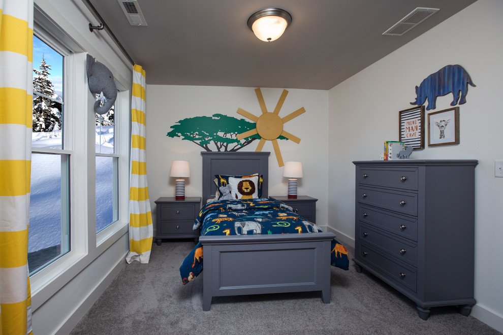 This is an example of a mid-sized arts and crafts kids' bedroom for kids 4-10 years old and boys in Louisville with grey walls, carpet and grey floor.