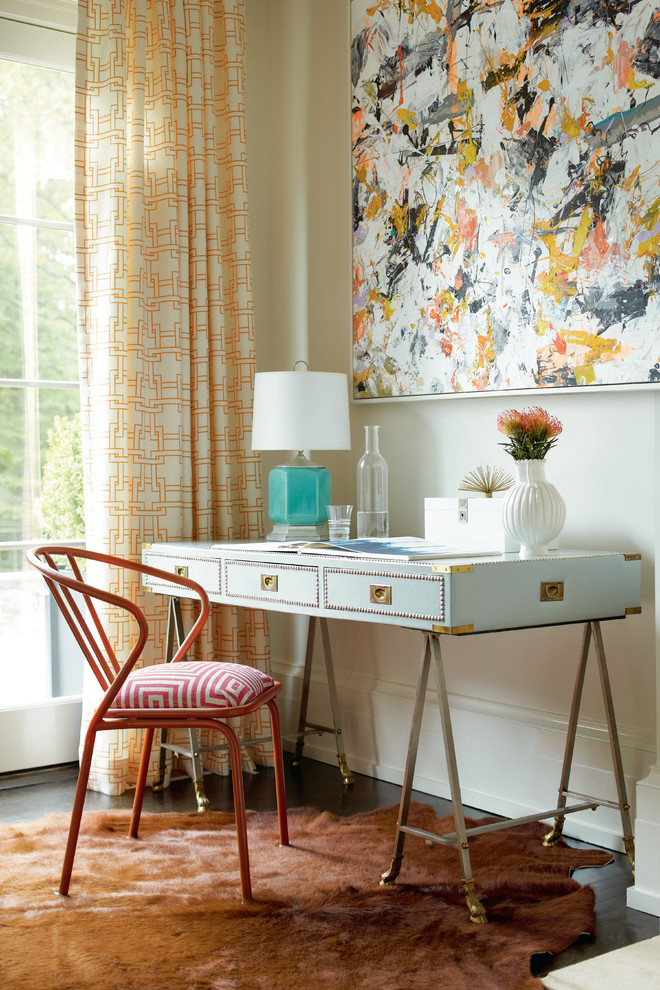 This is an example of a transitional home office in Other with white walls and a freestanding desk.