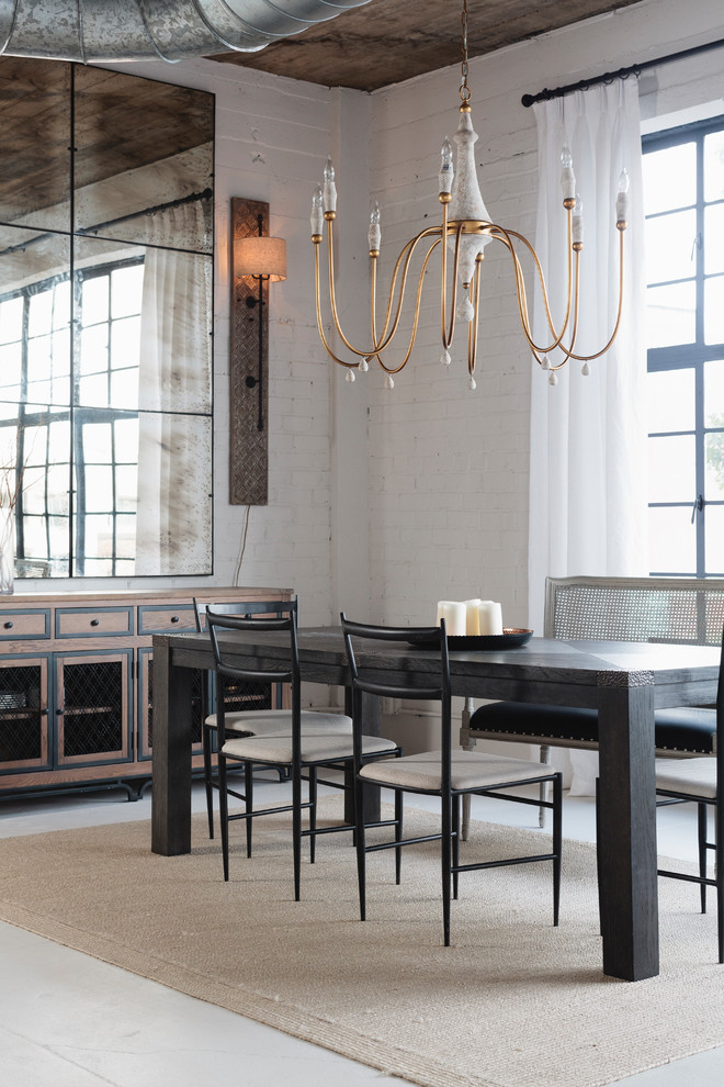 Inspiration for an industrial dining room in Birmingham with white walls, concrete floors and white floor.
